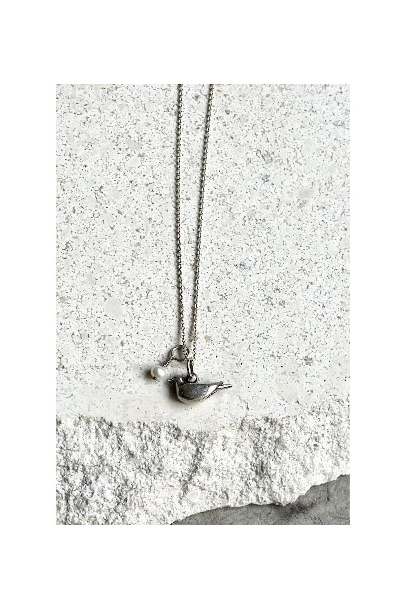 Silver necklace with bird pendant and pearl