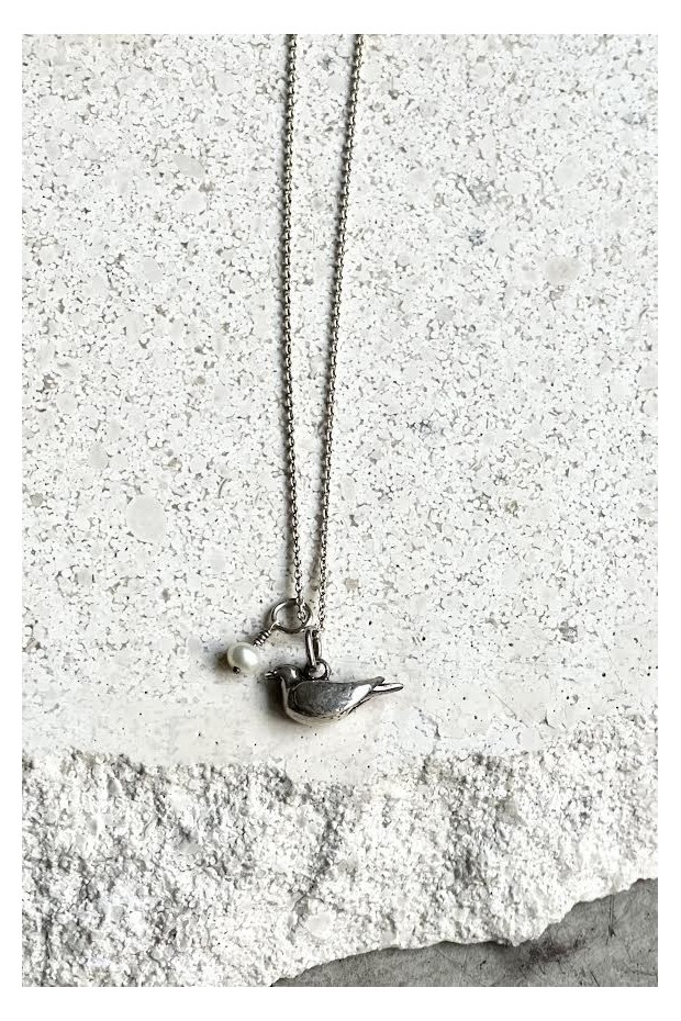Silver necklace with bird pendant and pearl