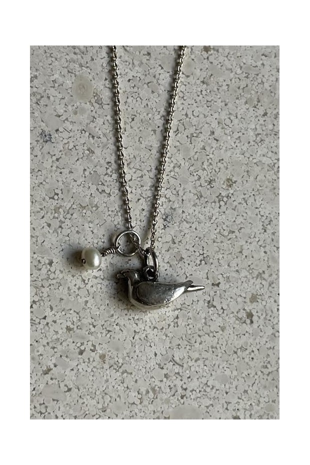 Silver necklace with bird pendant and pearl