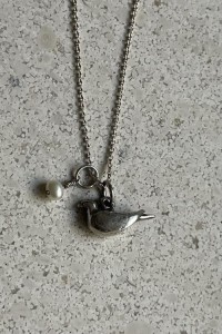 Silver necklace with bird pendant and pearl