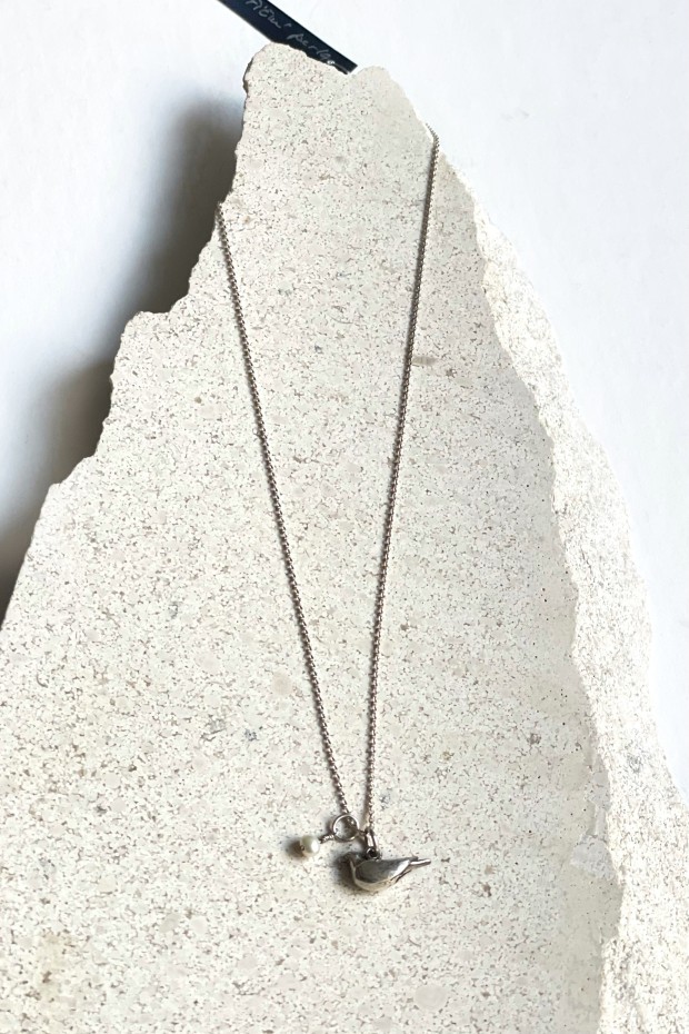 Silver necklace with bird pendant and pearl